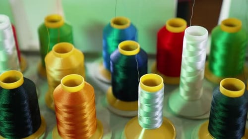 Threads in spools for dressmaker. Collection of colorful threads. Sewing tools.