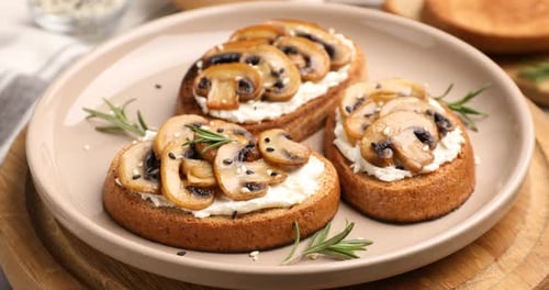 Delicious mushroom toasts, gourmet snack on a plate