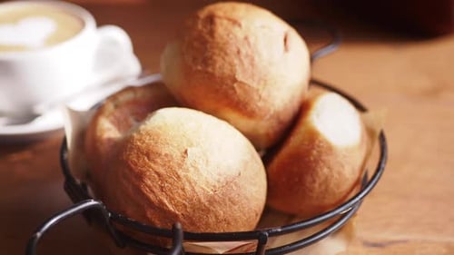 Freshly Baked Bread Rolls Presented in a Beautiful Rustic Basket for Your Enjoyment