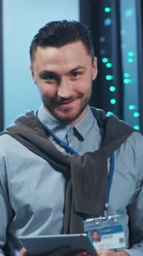 A Skilled Professional Working in a Data Center Environment Utilizing a Tablet Device Effectively