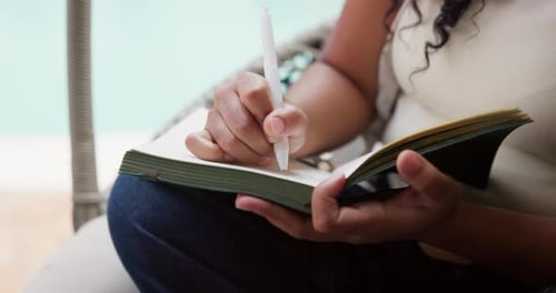 Woman Writes in Journal, Outdoor Setting on Patio