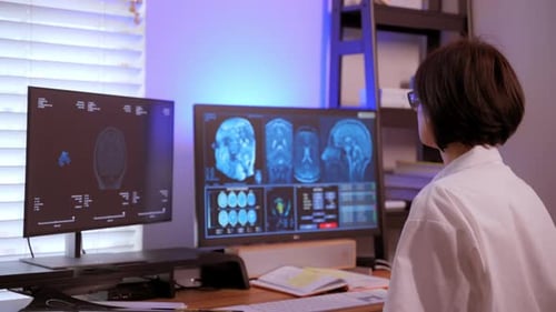 The Doctor Analyzes a Patient's MRI Scan Together to Diagnose Brain Conditions and Plan Treatment in