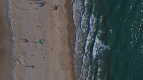 Kite Surfers Navigate the Windy Tarifa Beach with Isla De Las Palomas Lighthouse