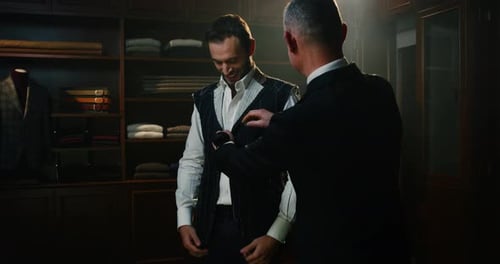 Cinematic shot of professional tailor taking measurements of client for creation custom tailored s