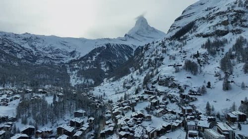 Majestic Snow Covered Matterhorn Peak Above a Scenic Alpine Village
