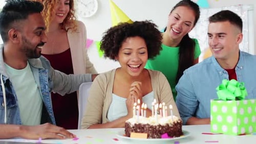 Friends Celebrate Birthday with Cake and Party Blowers