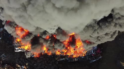 Fire Huge Fire at a Car Junkyard Black Smoke Pollutes the Atmosphere Ecological Disaster Global