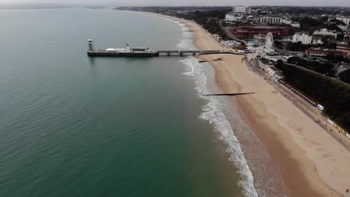 Aerial footage of the beautiful beach of Bournemouth showing the coastal area