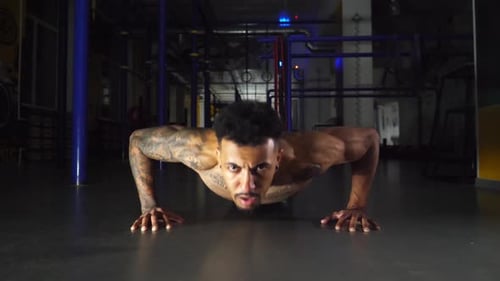 Strong Black Man Doing Push Ups at Modern Gym Afro American Sportsman Exercising at Sport Club