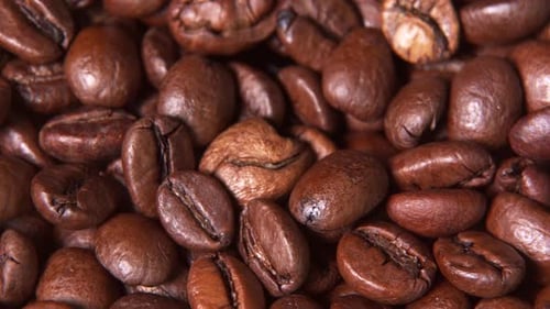 4k macro coffee beans rotating view, closeup roasted coffee beans