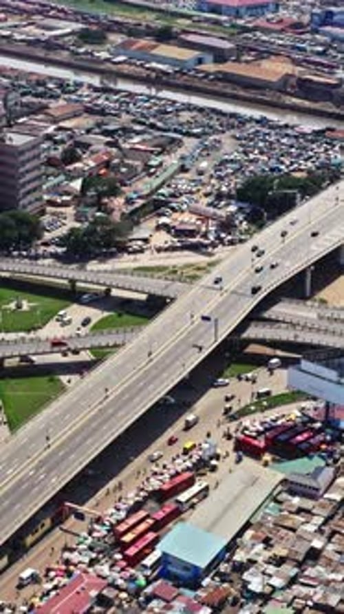 Aerial view of Accra showcasing traffic and market activity