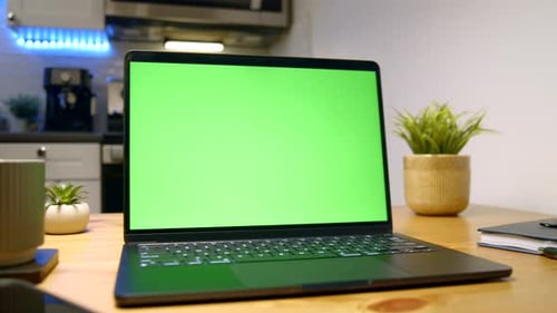 Cozy Workspace With Laptop Featuring Green Screen Mockup In Modern Kitchen