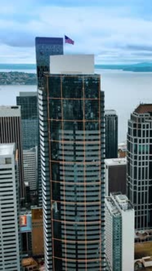 American business district flight over. Aerial view skyscrapers Seattle city. Vertical video