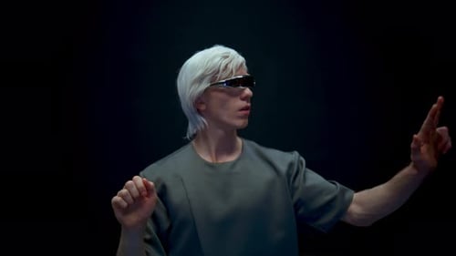 Man with AR Glasses Touching Invisible Interface