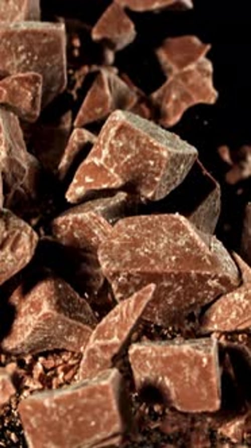 Super Slow Motion Pieces of Dark Milk Chocolate Filmed on a Highspeed Camera at 1000 Fps