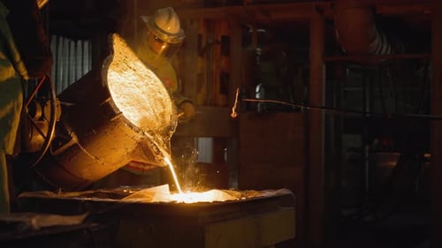 Foundry Worker Pouring Molten Metal