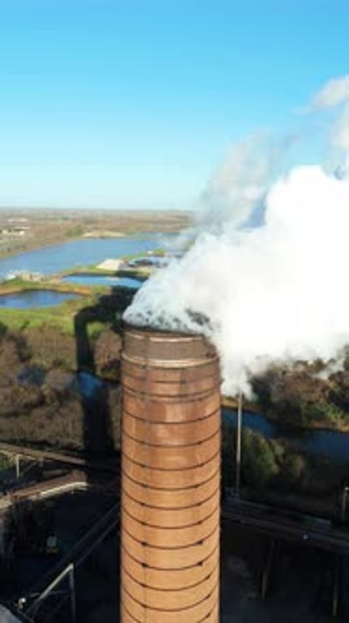 Aerial view of industrial chimney stack, United Kingdom.