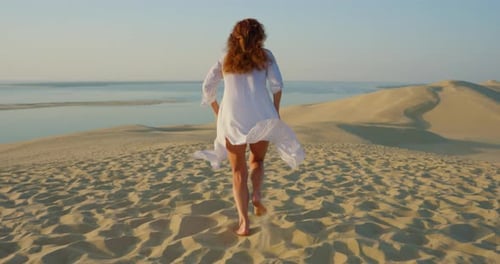 Beautiful Tall Woman Running Long Beautiful White Clothes Flowing in the Wind the Sunset By Scenic