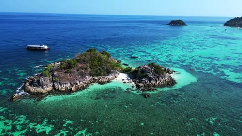 beach rocky cliff island turquoise blue sea. Marvelous aerial top view flight descending drone
4k fo