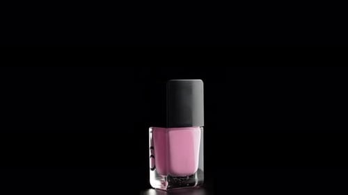 Pink Nail Polish Rotating on Black Background