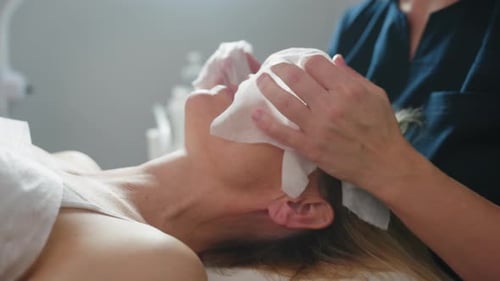 Woman Receiving Relaxing Facial at Medical Spa