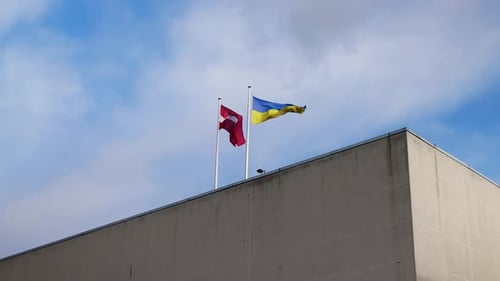 Flags on building waving in the breeze