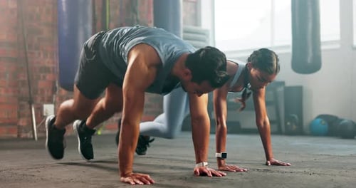 Health, fitness and class with couple in gym for workout, coaching and cardio
