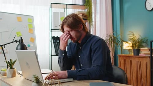 Bored Sleepy Businessman Worker Working on Laptop Rubbing Eye Pinch Nose Pain Headache at Office