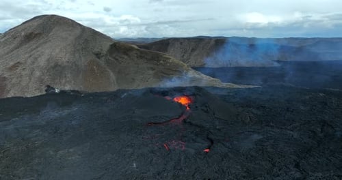 Icelandic Volcano Eruption With Glowing Red Lava Bursting To The Surface