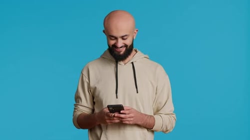 Bearded Man Uses Mobile Phone