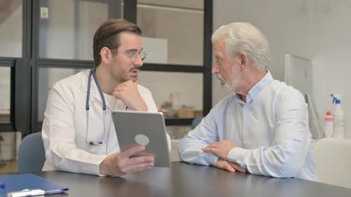 Doctor Explains Medical Information to Senior Patient
