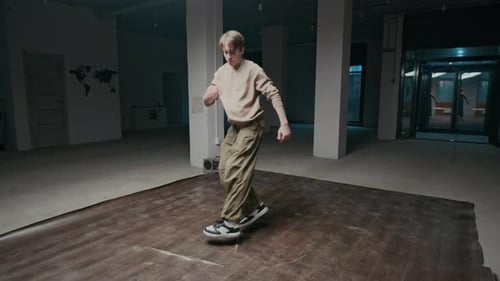 Young Adult Breakdancing in Urban Setting