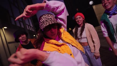 Group Dancing in City at Night with Modern Styles