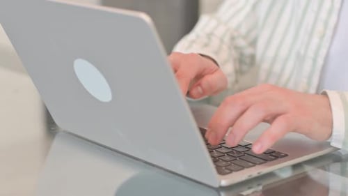 Close up of Hands Typing on Laptop