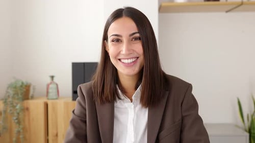 Young Attractive Business Woman Smiling at Camera Sitting at Office Workplace