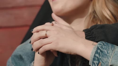 Girlfriend embraced kissing boyfriend's hand, romantic close up