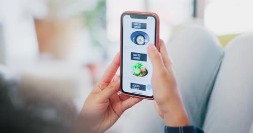 Woman Scrolling on Food Delivery App on Phone
