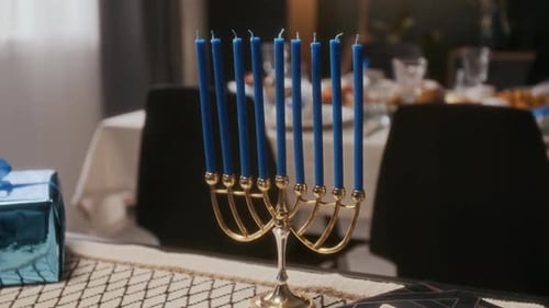 Menorah with Blue Candles and Star of David Book