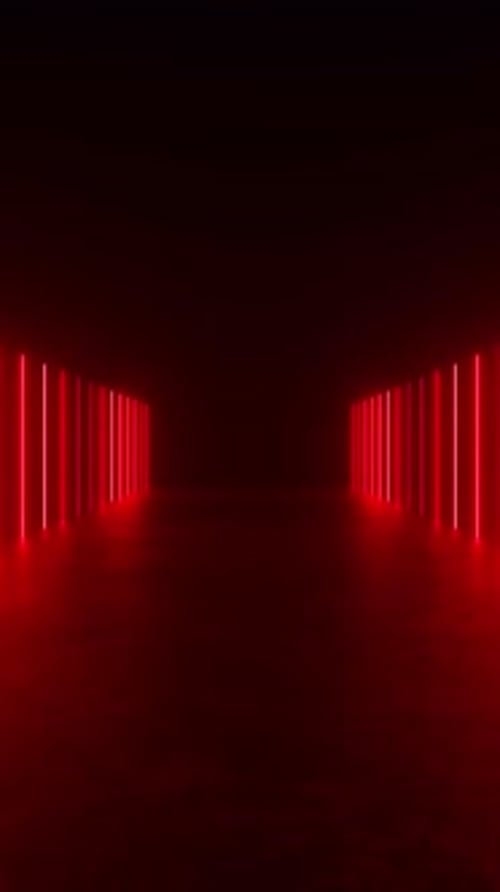 Un pasillo oscuro iluminado por luces rojas de neón que crea una atmósfera futurista y misteriosa.