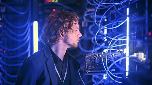 Man analysing servers in a data center