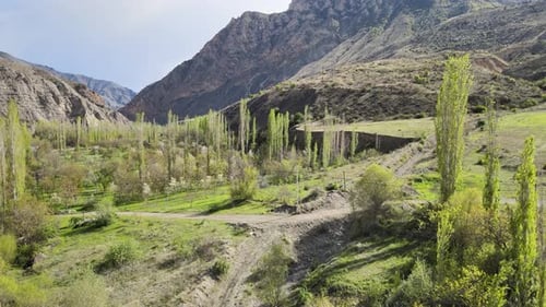 Scenic Valley Surrounded by Towering Mountains