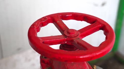 Close-up of a red valve handle