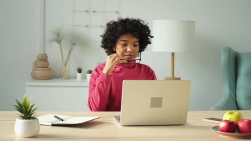 African American Girl at Home Office Relaxing Stretching Hands and Body Taking Break From Work on