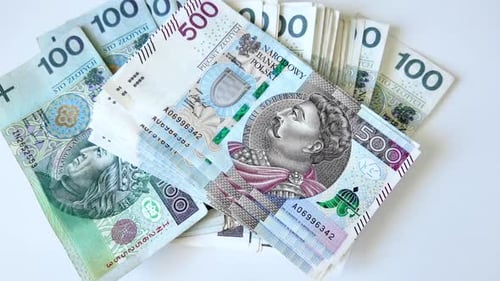 Polish banknotes lie on the table, top view. Theme wealth, business and currencies.