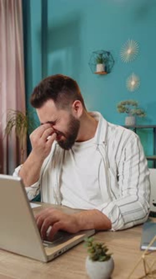 Bored Sleepy Businessman Worker Working on Laptop Rubbing Eye Pinch Nose Pain Headache at Office