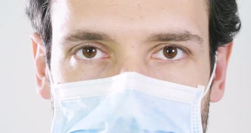 Portrait of a beautiful man doctor smiling showing a perfect smile, on professional clinic. Concep