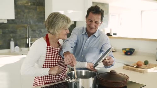 Couple Cooking Together in Bright Modern Kitchen