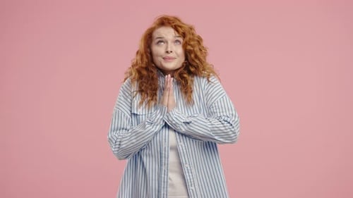 Woman with Curly Red Hair Begging and Pleading