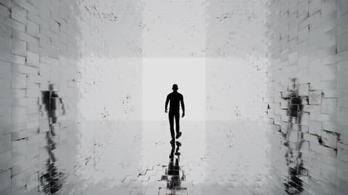 Man walks into the light in a reflective tunnel