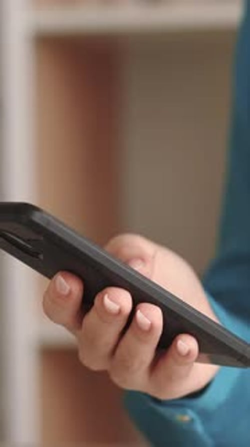 Hand Using Black Mobile Smartphone Device